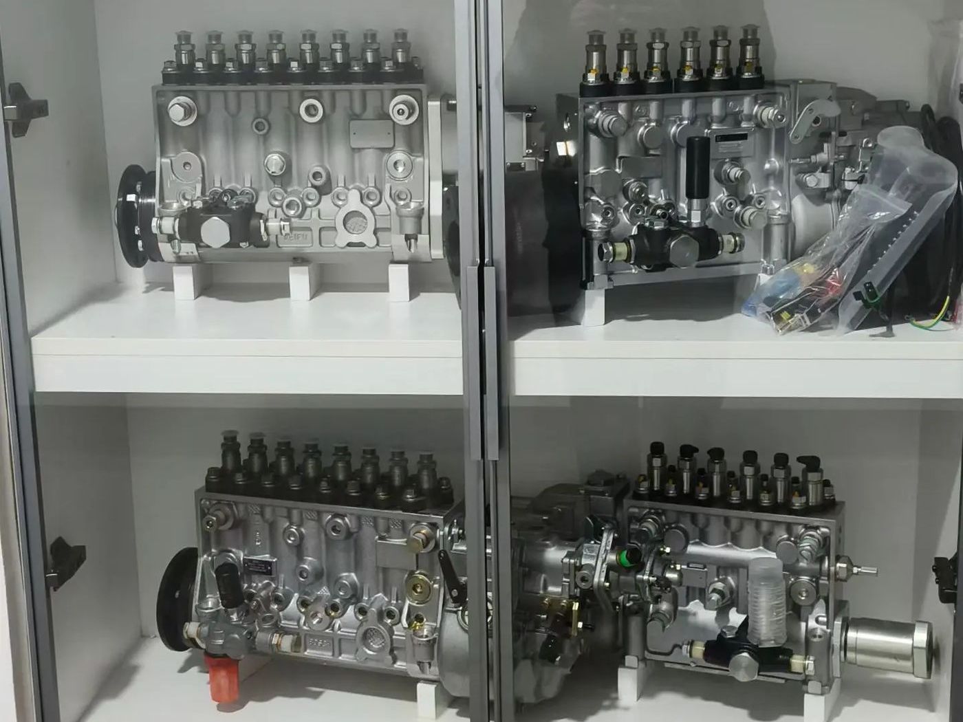 Shelves of reconditioned and new fuel injection pumps in stock